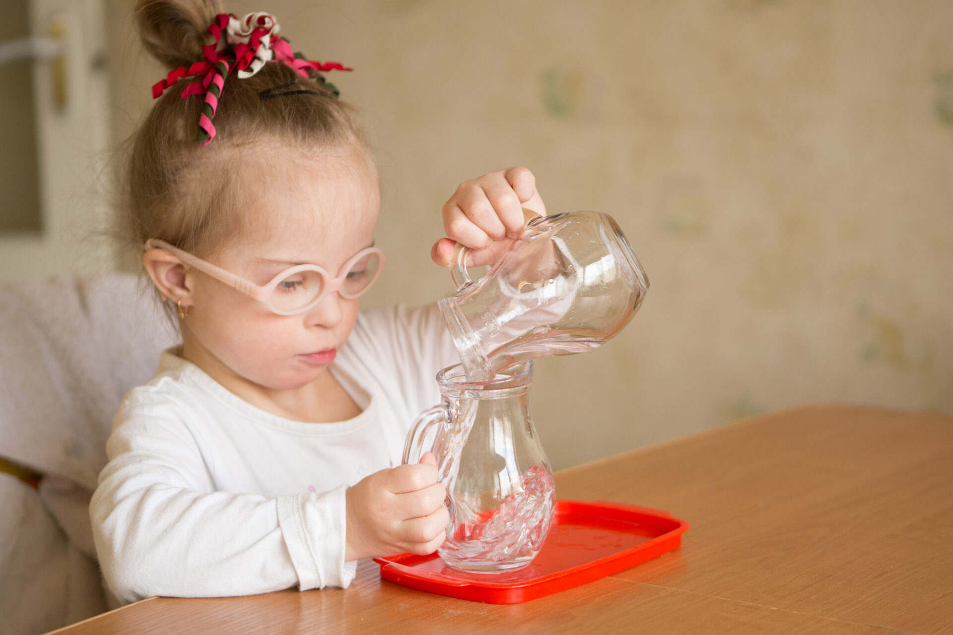 Unlock Your Child's Motor Skills with a Fun Montessori Activity: Pouring Equally to Many Containers