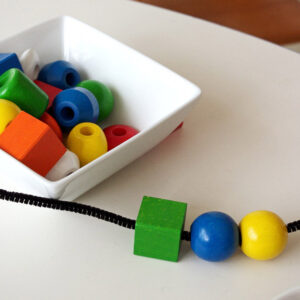 Unlock Your Child’s Motor Skills with a Fun Montessori Activity: Threading and Making Necklaces